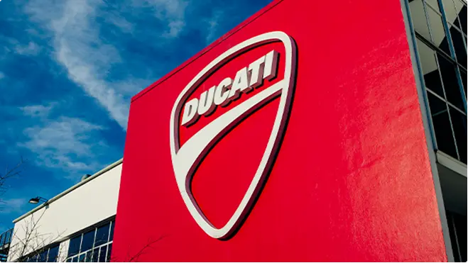 Ducati logo at the company’s headquarters in Bologna The iconic Ducati logo on the façade of the company’s headquarters in Borgo Panigale, Bologna.